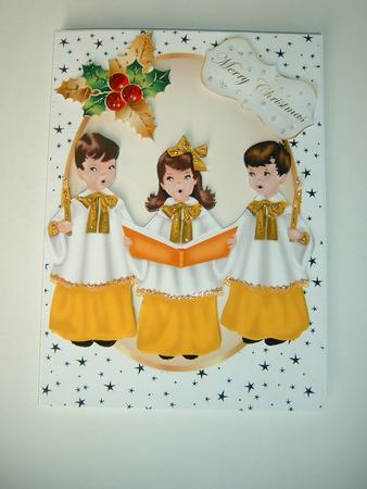Carol Singers in Gold in Oval Frame with Stars by Julie McGregor