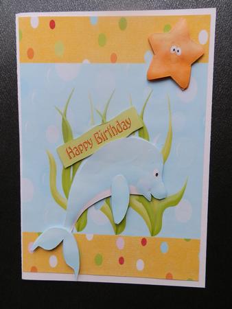 Cute Blue Dolphin with Gold Star Fish by Julie McGregor