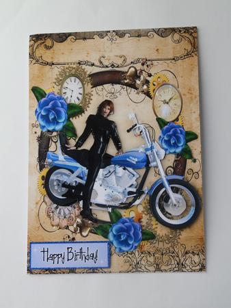 Lady Biker in Steam Punk Frame with Blue Flowers by Julie McGregor