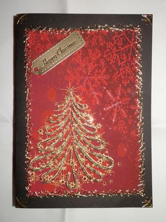 Gold Christmas Tree on Red Snowflakes Background by Julie McGregor