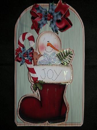 Snowman in Stocking on Wooden Tag with Candy by Julie McGregor