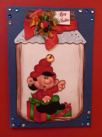 Santas Elf in a Jar with Present and Big Bow by Julie McGregor