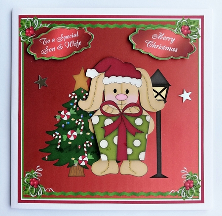 Christmas Bunny holding gift with sentiment tags by Julie Hassall