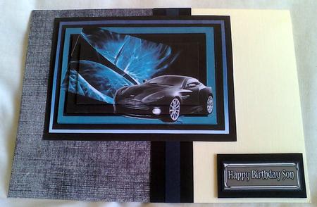 Aston Martin Vanquish on Blue Abstract Pyrami Featured Gallery Photo