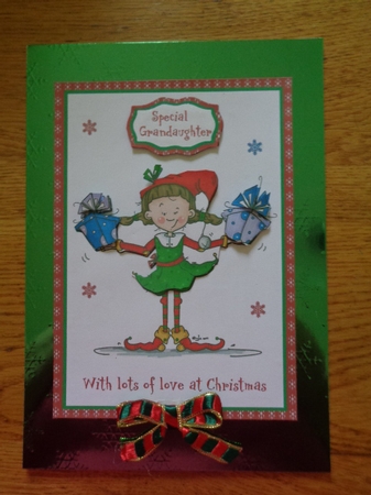 Christmas card with cute elf carrying gifts with decoupage by Karen Faulds