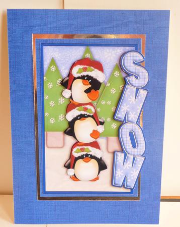 Balancing Penguins Christmas Over the Side by Karen Nash