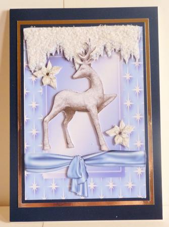 Silver Reindeer with White Poinsettias in Blue Star Frame by Karen Nash