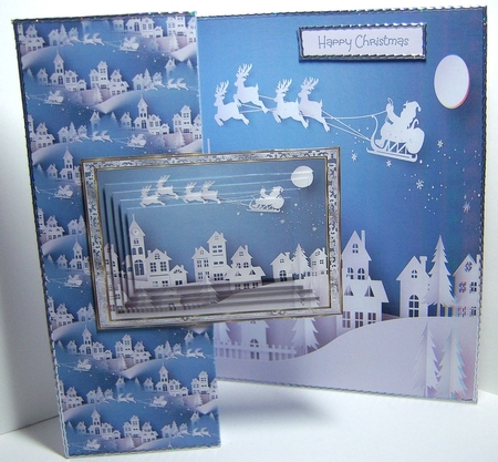 Santa in flight over the town by Katie Silver
