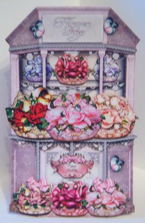 Beautiful White Flower Shop with Baskets Full of Roses by Katie Silver