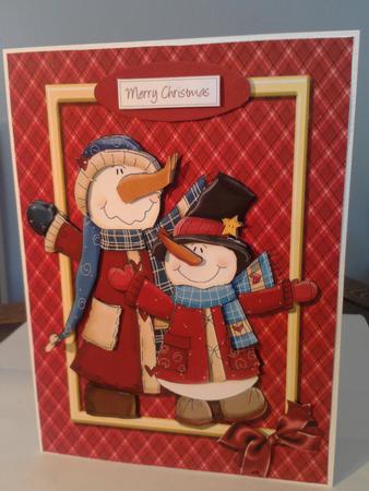 Two Dark Red Snowmen in Gold Frame by Katy campbell