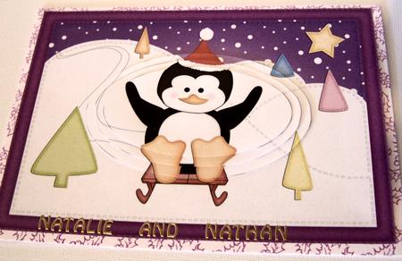 A5 Xmas Sledging Penguin Oval Pyramage Topper by Kris Smart