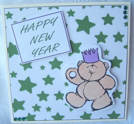 Christmas Stars in Green on White Background Paper by Kris Smart