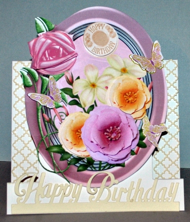 Pink and cream flowers in oval frame by Kristina Norbat