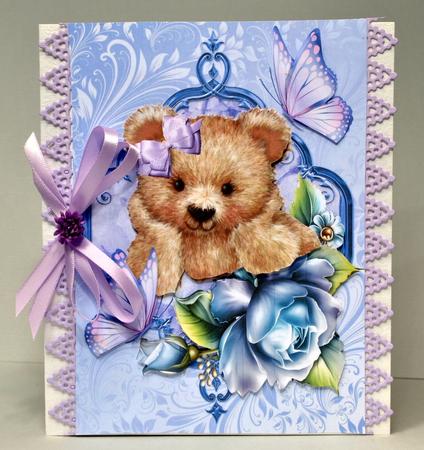 Cuddly Brown Teddy in Blue Rose Frame by Kristina Norbat