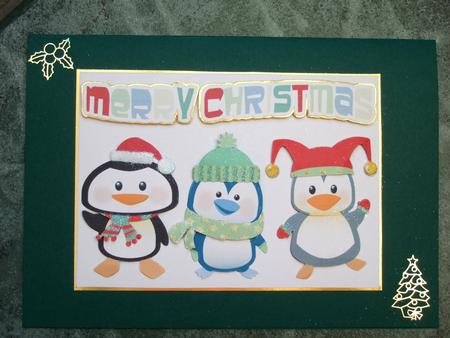 Cute Christmas Penguins. by Laraine Spink