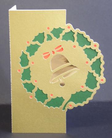Christmas Bell Framed In Holly Over The Edge Card by Laura Nicholls