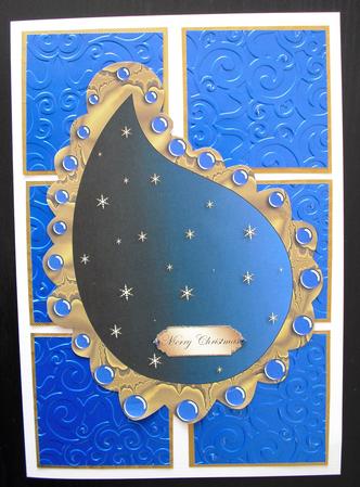 Large Sky Blue Paisley Shaped Topper with Snowflakes by Lesley Earing