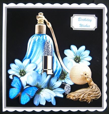 Blue perfume and flowers by Linda Short
