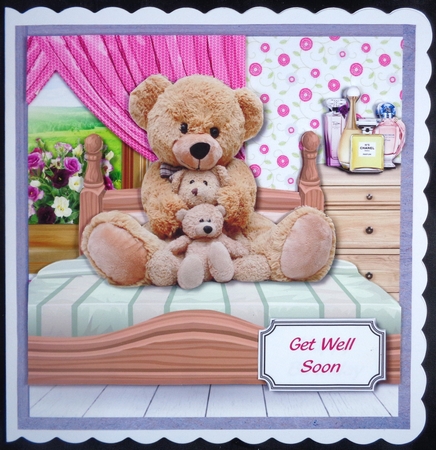 Three teddies sat on bed by Linda Short