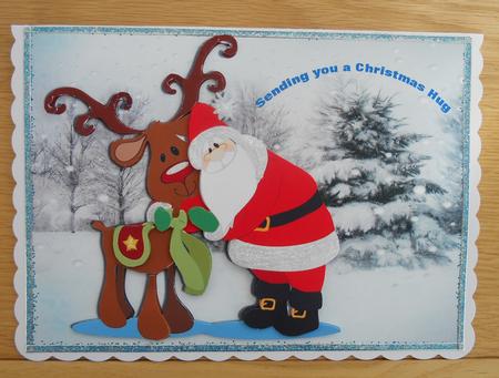 Big Santa Cuddles with His Reindeer by Linda Short