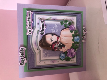 Girl with makeup on purple background by Liz Kiely