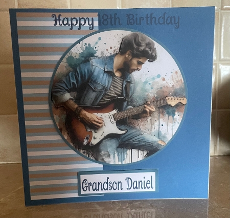 Playing the Guitar by Liz Kiely