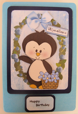 Little Penguin Carrying a Basket of Flowers A4 Topper by Lorraine Appleby