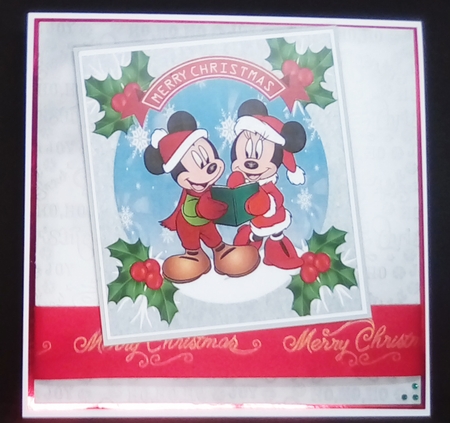 Lovely mickey mouse snow scene with holly toppers by Louisa Price