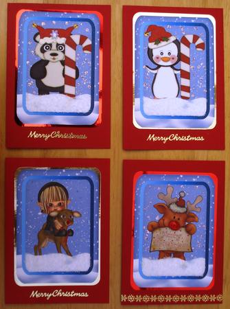 4 Christmas Toppers with Various Creatures by Louise Burke