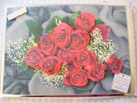 Red Roses & Gypsophila on Textured Black & White Background by Lyn Webb