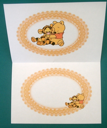 Little bear hugging a tiger with in oval gingham frame insert by Lynda Harman