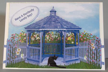 Black Cat in Flower Garden & Blue Gazebo Pyramid Card Front by Lynda Jones