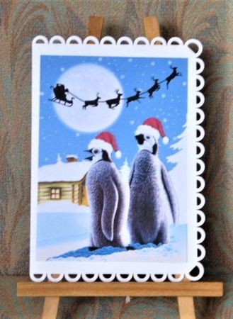 Lovely penguins in snow scene A4 by Lynn Butters