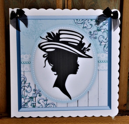 Silhouette Lady in Blue Frame  by Lynn Butters