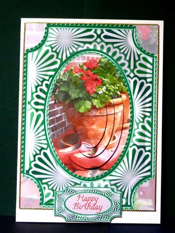 Red Wooden Clogs and Geraniums Framed Oval Pyramid by Lynn Butters