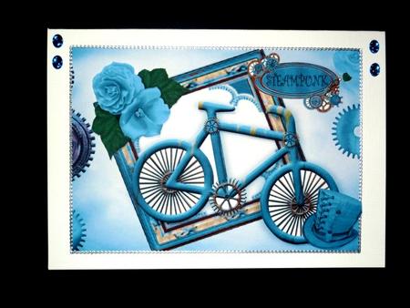 Ladies Turq Bike with Hat and Rose in Steampunk Frame A4 by Lynn Butters