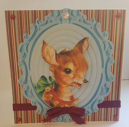lovely reindeer with spotty bow oval pyramids in ornate frame by Lystra Jordan