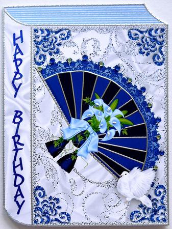 Lace Blue Fan with Flowers on Folded Book by Margaret Dittmann