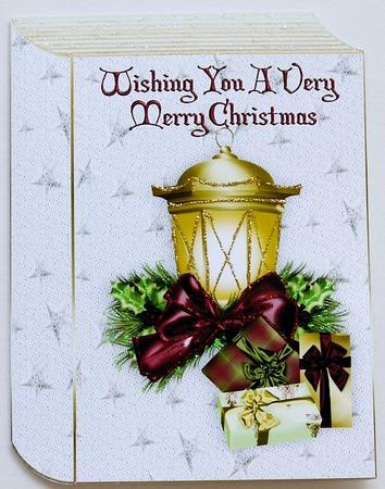 Christmas Candle and Presents on Star Folded Book by Margaret Dittmann