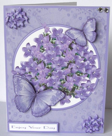 Butterflies and flowers greeting card in lilac by Margaret McCartney