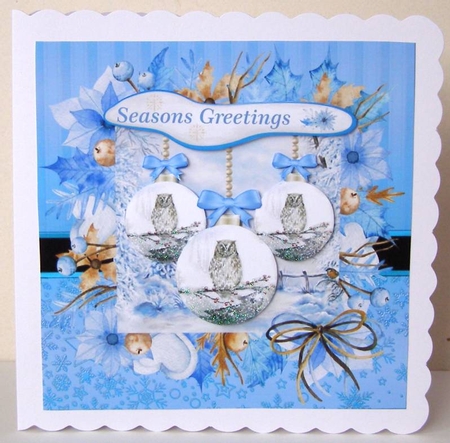 Blue winter owl bauble Christmas card front by Margaret McCartney