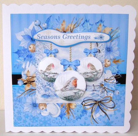 Blue winter robin bauble Christmas card front by Margaret McCartney