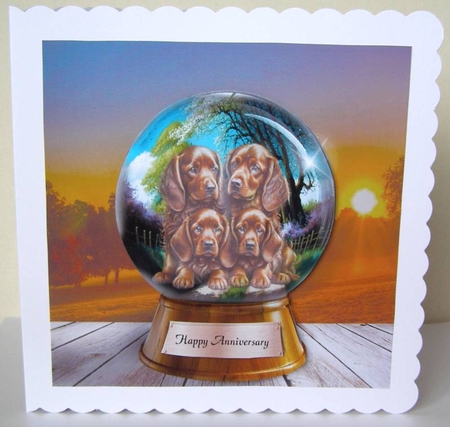 4 puppies in a globe  by Margaret McCartney