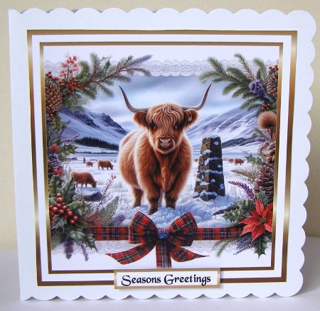 Cow and cairn at christmas by Margaret McCartney