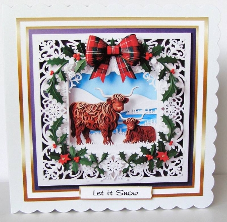 seasonal mix christmas highland coo  papercut by Margaret McCartney
