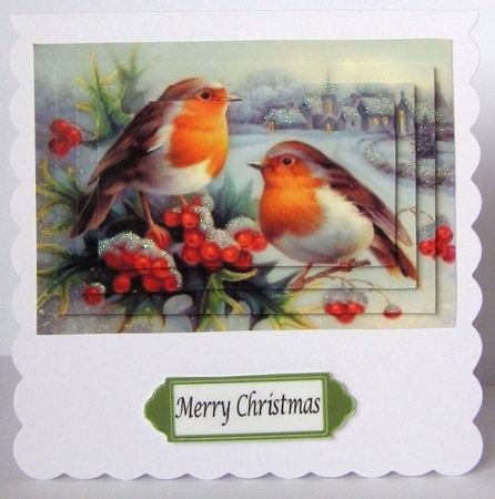 two lovely little robins with a snow village pyramids by Margaret McCartney