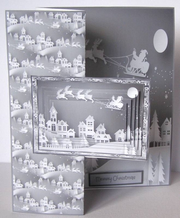 Santa flying over the roof tops by Margaret McCartney