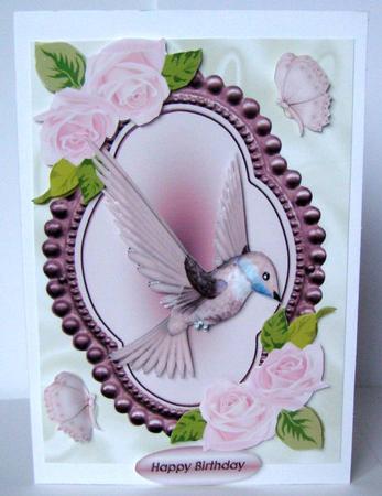Humming Bird with Pink Roses by Margaret McCartney