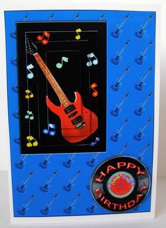 Red Guitar Rocking on Blue by Margaret McCartney