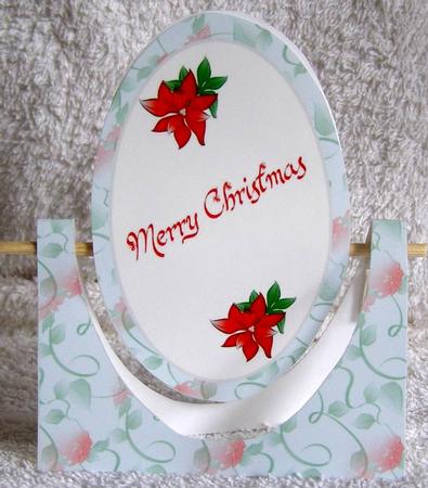 Poinsettia Oval Spinner Card by Margaret McCartney
